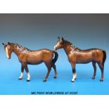 A Beswick standing horse together with another with head turned