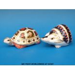 Two Royal Crown Derby paperweights, one in the form of a tortoise (with gold stopper),