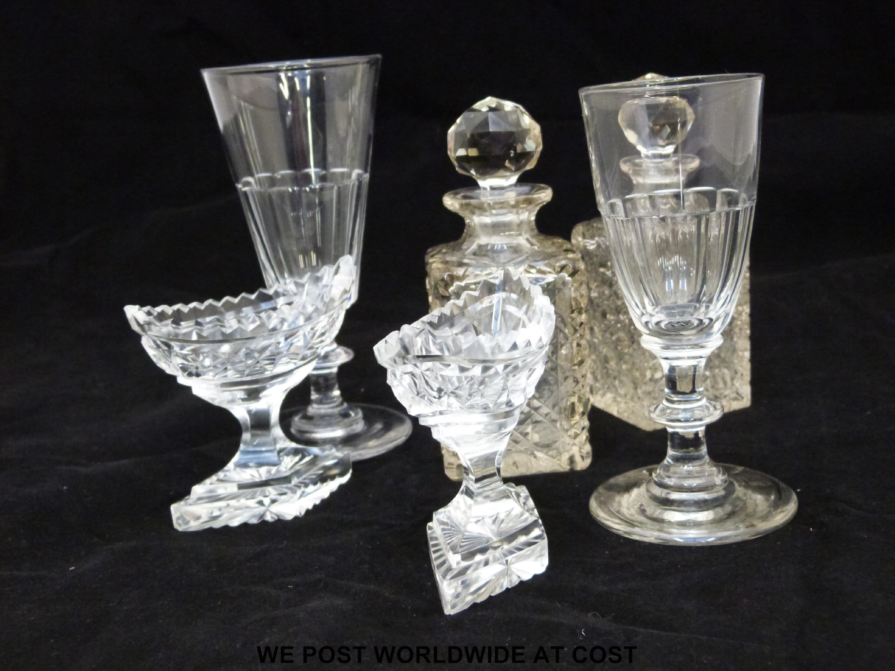 A collection of clear glassware to include two early wine glasses,