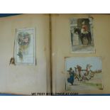 A Victorian / 20thC scrapbook containing cards, postcards and oddments including animals,