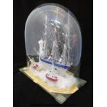 A spun and trailed clear glass ship with blue and cranberry decoration, possibly Nailsea,