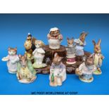 Ten Beswick Beatrix Potter figures and a base