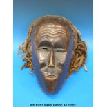 A Chokwe (Angola) mask with braided hair (bought in the 1960's from an English Ex pat teacher