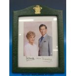 A signed Princess Diana and Prince Charles photograph dated 1992 in official crested leather