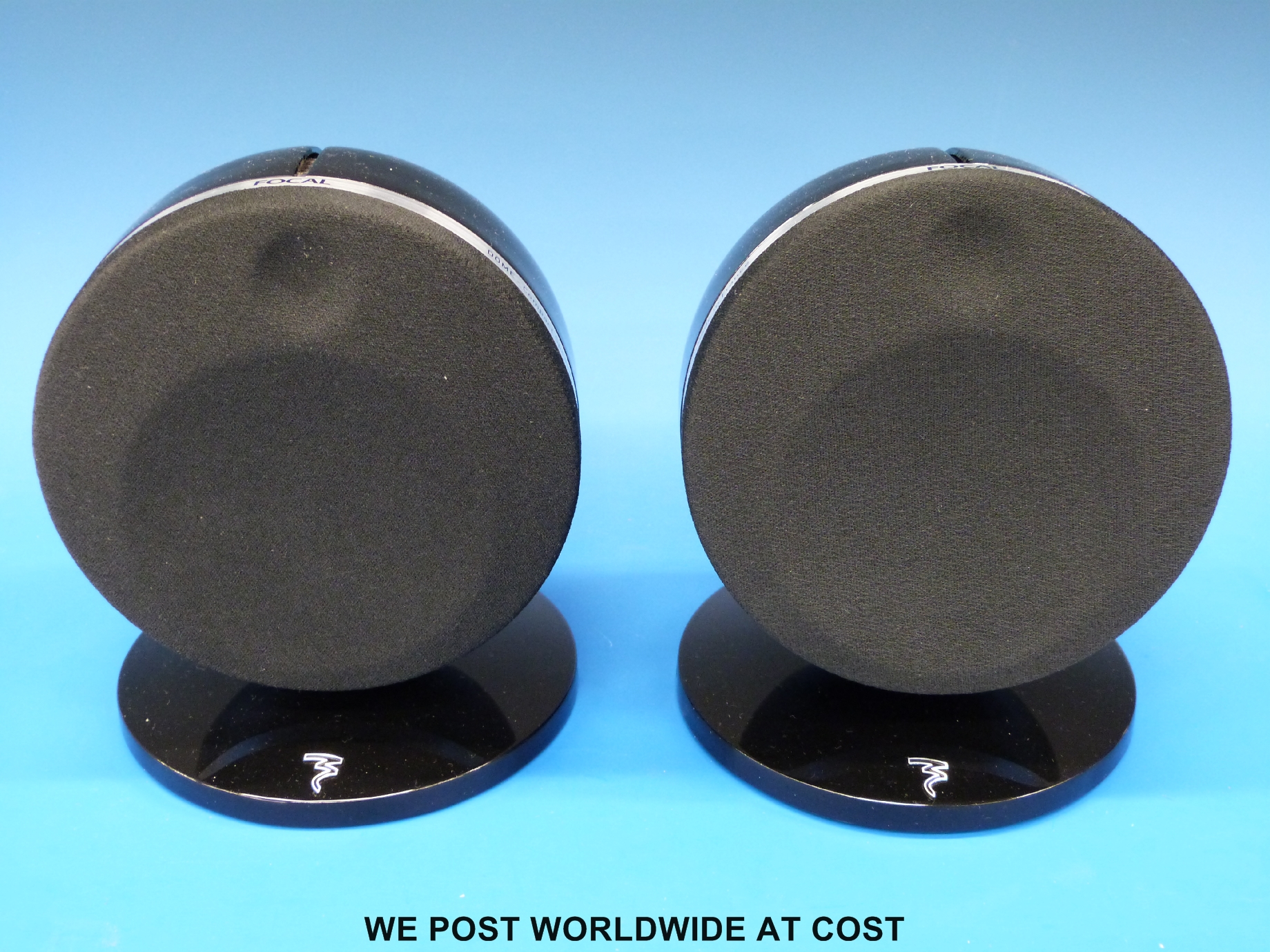 A pair of Focal Dome compact speakers with stands.