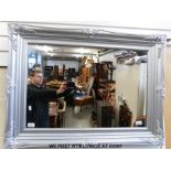 A silver framed mirror (94 x 70cm)