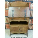 An Arts and Crafts or Art Nouveau style oak students bureau bookcase (W68 x D35 x H128cm)