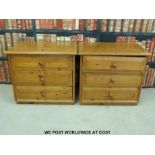 A pair of pine bedside chests of three drawers (width 63cm)