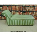 A green upholstered day bed.