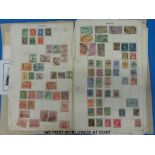 A folder of all world stamps on loose album pages and small quantity of postcards