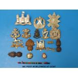A quantity of military badges, including Cameron, King's Own Scottish Borderers etc,