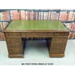 A mahogany twin pedestal desk (W135 x D74 x H74cm)