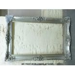 A large silver picture frame (overall size 123 x 183cm)