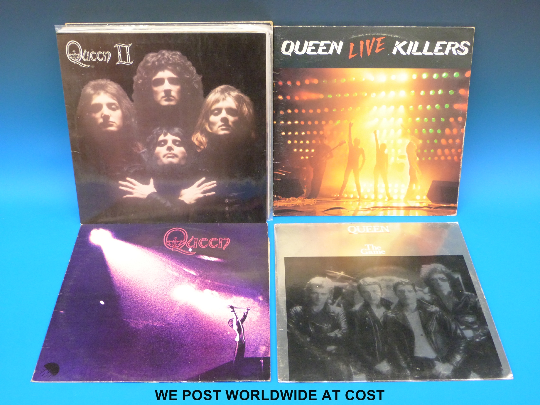 Thirteen LPs by Queen,