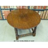 An oak circular coffee table.