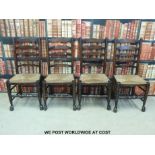 Four rush-seated oak ladder back chairs