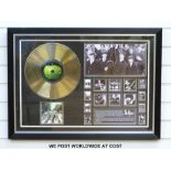 A framed and glazed gold disc of The Beatles album Abbey Road.