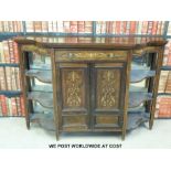 A Victorian rosewood credenza with central drawer and cupboards flanked by shelves (W138 x D40 x