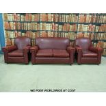 A red leatherette Art Deco style three piece suite