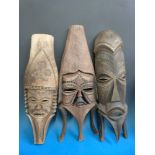 Three Hawaiian masks