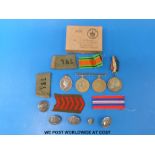 A WWII medal group comprising 1939 - 45 Defence medal, 1939 - 45 medal and Efficiency medal,