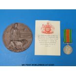 A WWI death plaque for Norman Edgar Dawson and a WWII defence medal