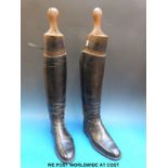 A pair of black leather riding boots with Maxwell of London trees together  with boot jack, spurs,