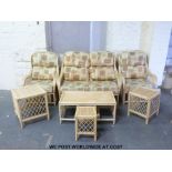 A cane conservatory suite comprising sofa, two chairs,