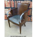 Twenty Art Deco style leather arm chairs with wicker inset side panels and curved metal arms raised