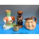 A Royal Doulton John Barleycorn vase, a treacle glazed Toby jug,