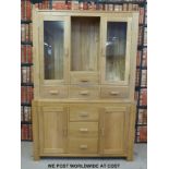 A modern oak dresser/ display cabinet (W135 x D43 x H200cm)