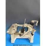 A Gravograph engraving machine complete with attachments and four sets of brass lettering,