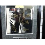 An autographed montage of the Rolling Stones album Sticky Fingers.