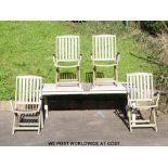 A rectangular teak garden table and four chairs