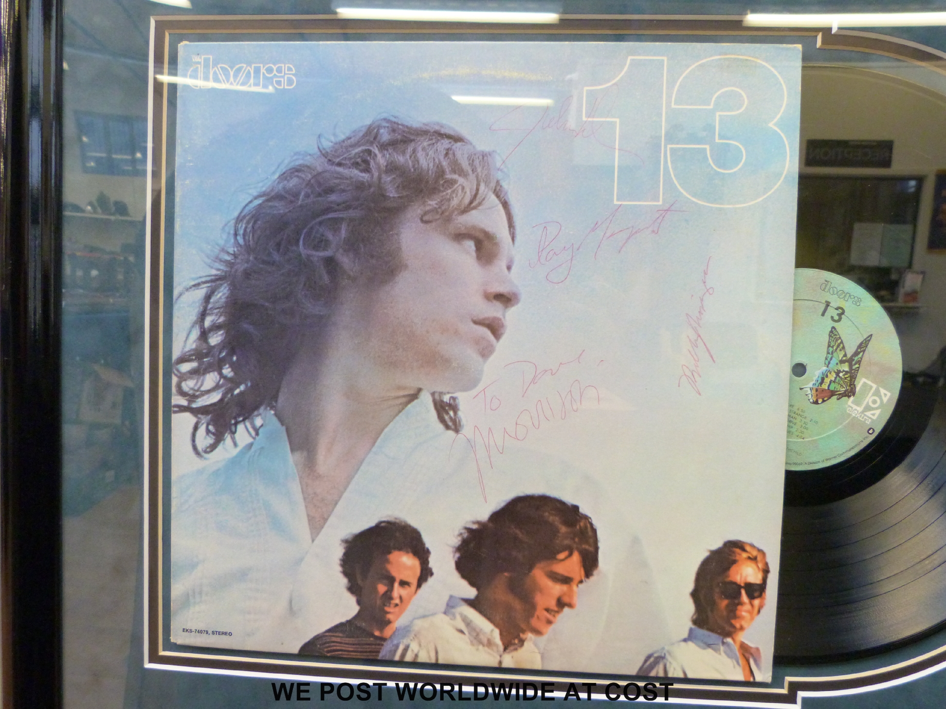 An autographed montage of the Doors album 13.