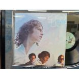 An autographed montage of the Doors album 13.