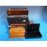 A wooden desk top ink stand, a small carved book slide,