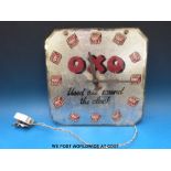 An 'Oxo used all round the clock' electric wall clock with Sectric movement (approximately 30cm