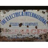 An enamel sign 'The Electric and International Telegraph Company' with further text regarding the