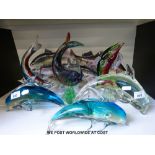 A collection of glass and ceramic fish