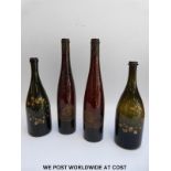 Two pairs of gilt decorated wine or spirit bottles;