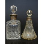 Two silver mounted cut glass scent bottles (15cm and 14cm tall)