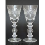 Eight large wine goblets/glasses with geometric cut decoration raised on triple knopped stems and