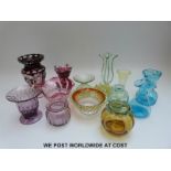 Fourteen pieces of coloured glassware to include flush overlaid cut glass vases,