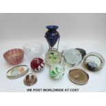 Nine various paperweights by Caithness and others together with a white metal mounted scent bottle,