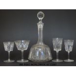 A suite of cut glass ware comprising two decanters, 9 wine glasses, 9 small wine glasses,