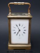 A brass carriage clock by Frodsham and Co, inscribed to dial and movement Chas.