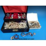 A quantity of costume jewellery to include brooches, watches, ceramic brooches,