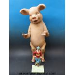 A butcher's advertising papier mache pig (height 67cm) and a cast metal figure of a golfer.