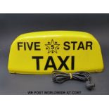 A 'Five Star' taxi magnetic roof sign